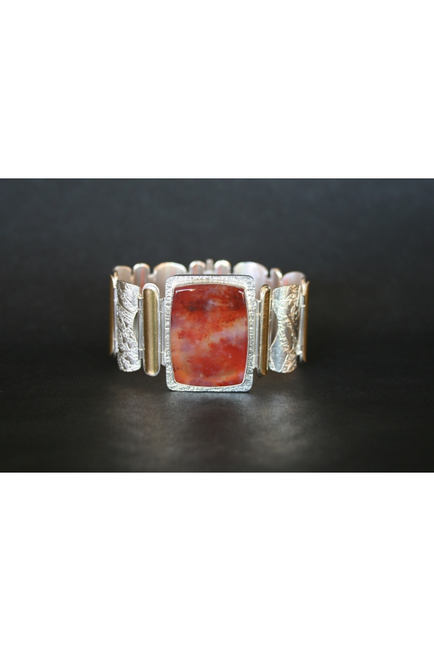 Hinged bracelet of sterling silver, 22k gold and plume agate.